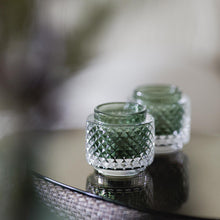  Set of tealight holders made of green glass